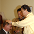 Rev. C.S. Lee praying words of blessings over him