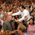 Rev. C.S. Lee walking down into the crowd and laying hands (2)